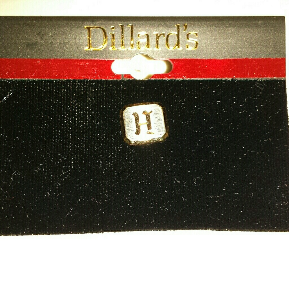 A tietack with an "H" monogram